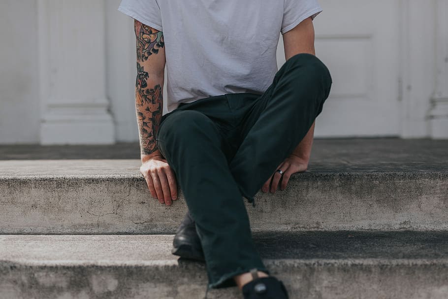 man tattoo steps sitting